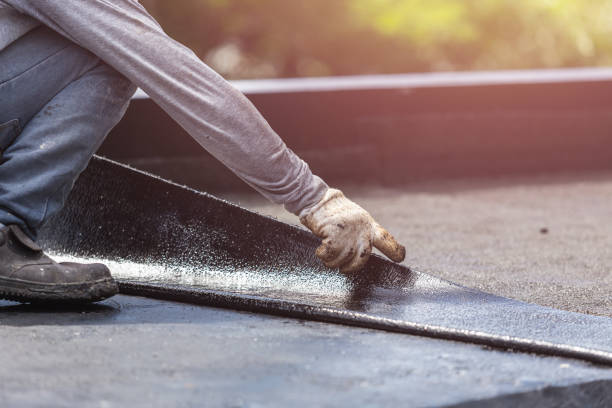 Professional Basement Waterproofing technician working in Old Fort, OH